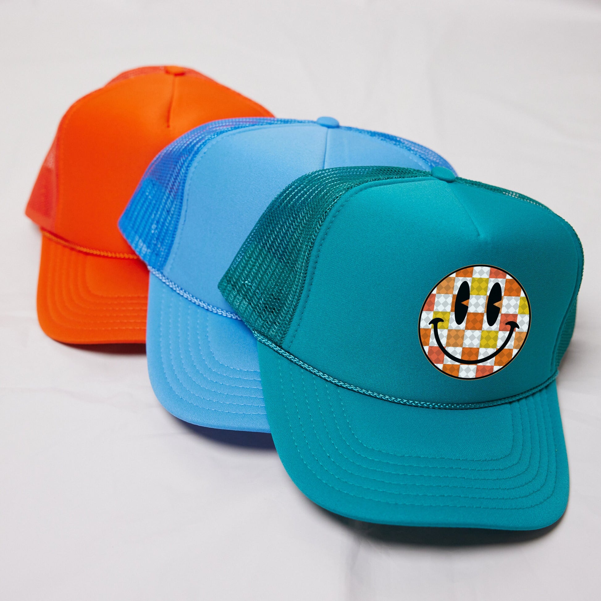 a couple of hats sitting on top of a white table