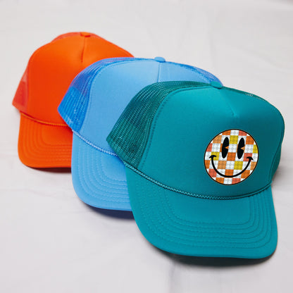 a couple of hats sitting on top of a white table