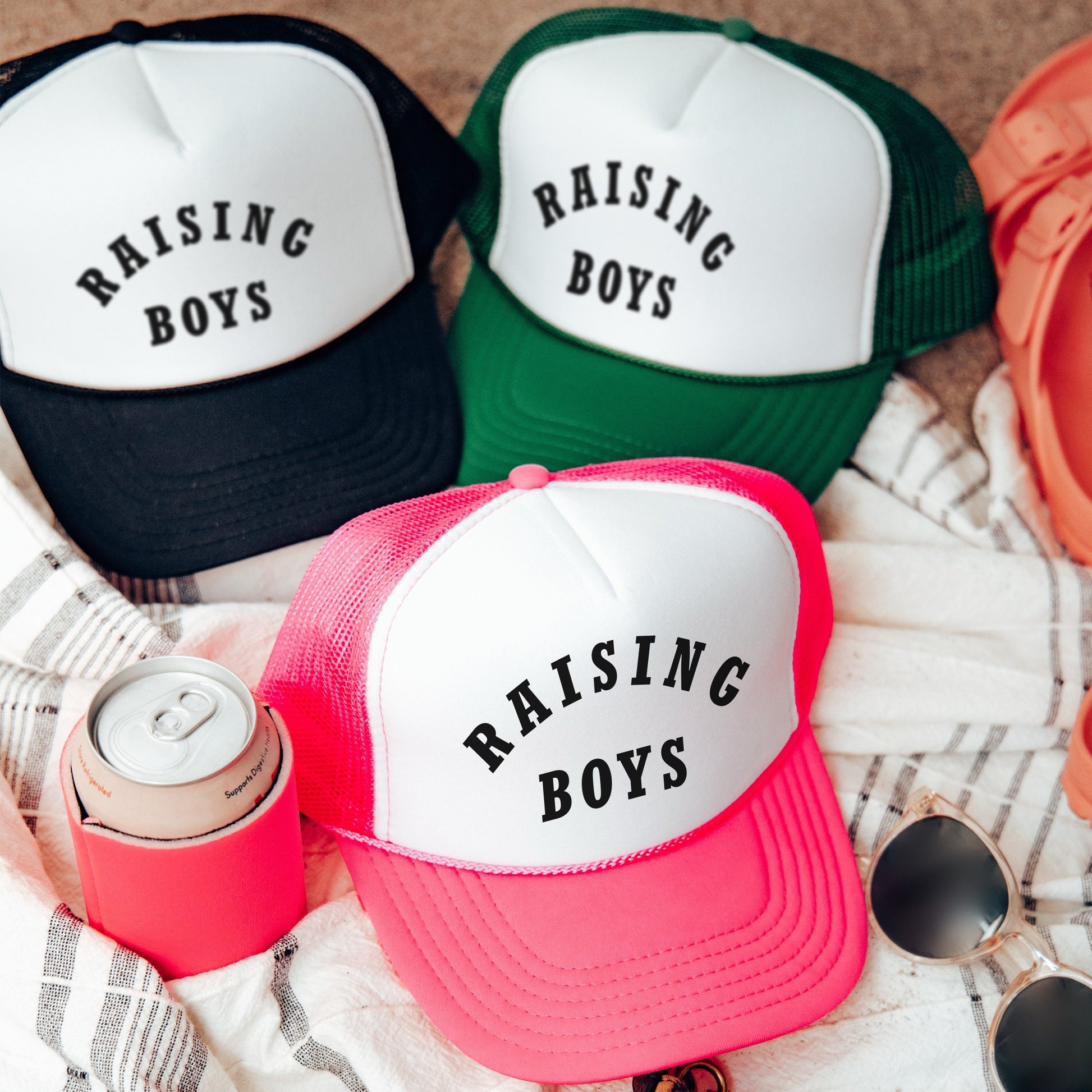 a couple of hats sitting on top of a blanket
