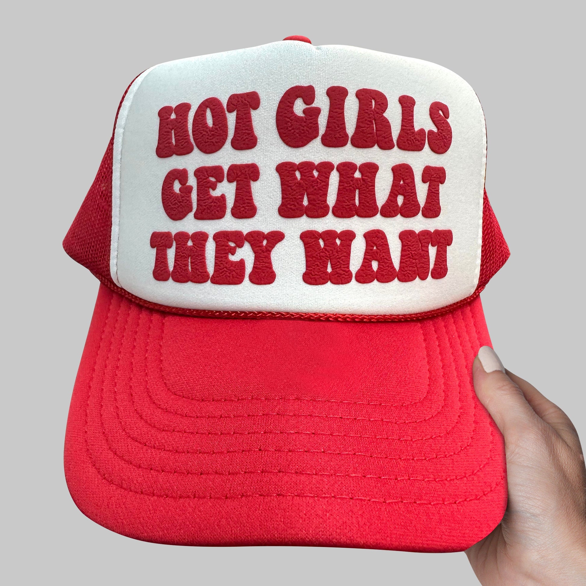 a red and white hat with the words, not girls get what they want