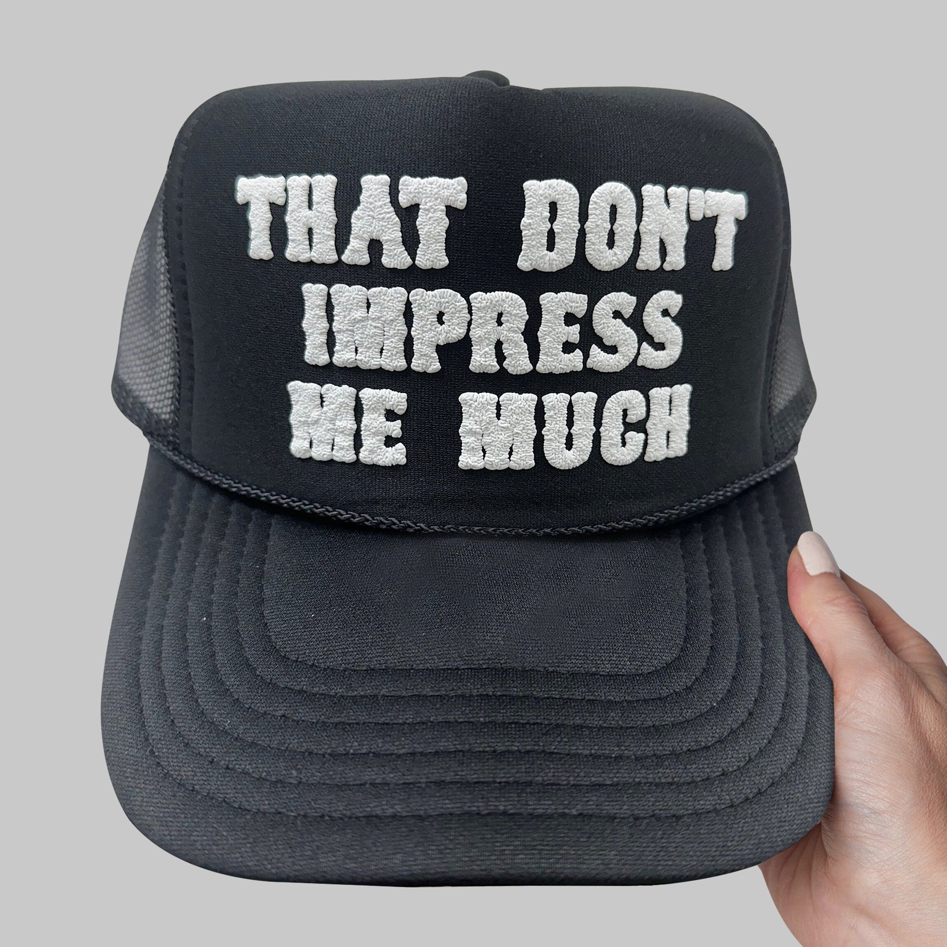 a black hat that says that don&#39;t impress me much
