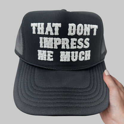 a black hat that says that don&#39;t impress me much
