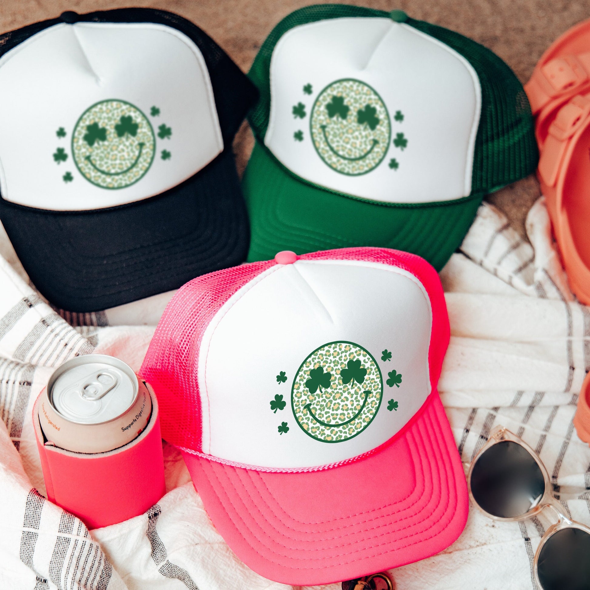 a group of hats sitting on top of a blanket
