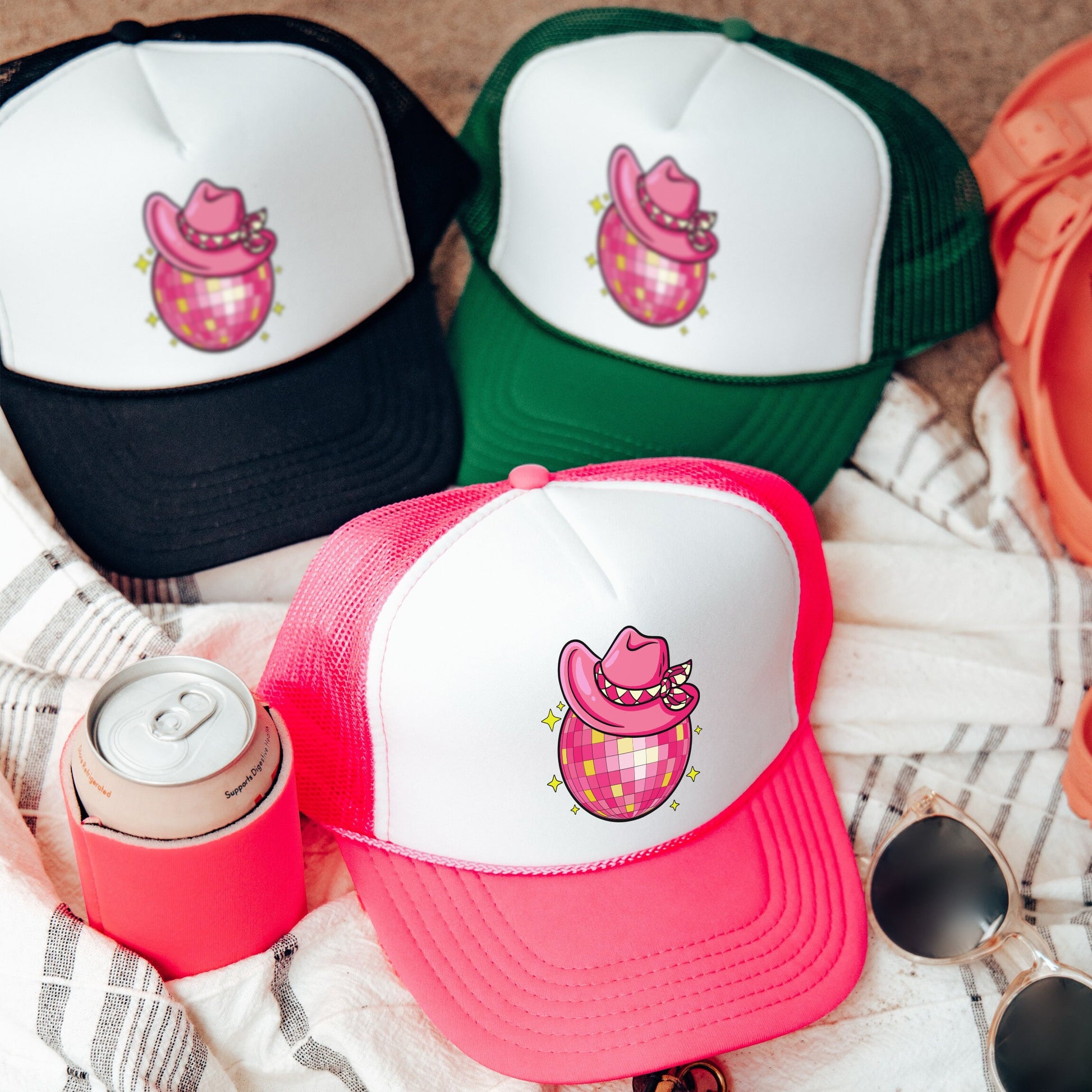 a group of hats sitting on top of a blanket